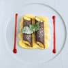 Schokocrepes-Cannelloni mit Mangomousse