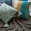 Strickanleitungen: Kissenhüllen und Wohndecke