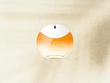 Nivea Sun Parfum auf einem Sand Hintergrund